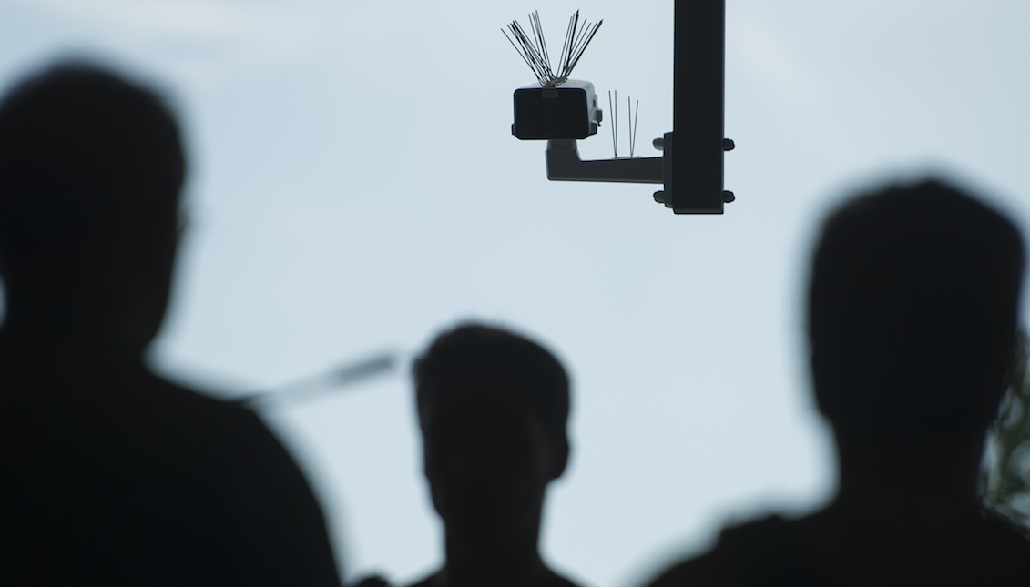 BERLIN, GERMANY - AUGUST 03: Passersby walk under a surveillance camera which is part of facial recognition technology test at Berlin Suedkreuz station on August 3, 2017 in Berlin, Germany. The technology is claimed could track terror suspects and help prevent future attacks. (Photo by Steffi Loos/Getty Images)