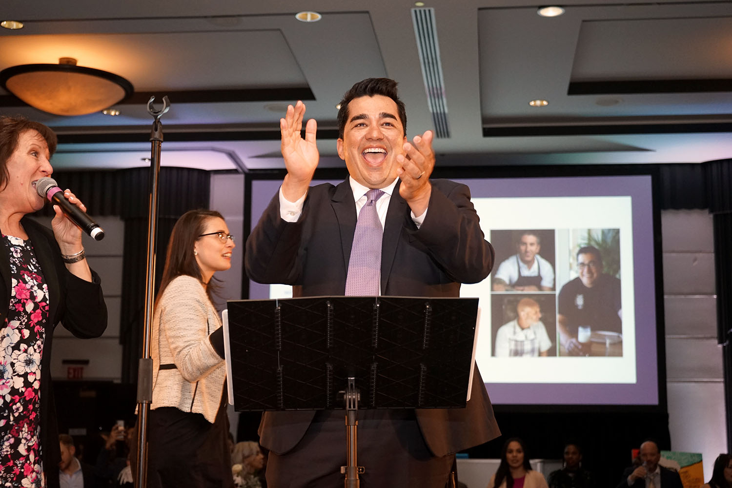 Chef Jose Garces pumps up the crowd during an auction at the Garces Foundation Benefit March 29  Photos: Peter Fitzpatrick/Al DIA News 