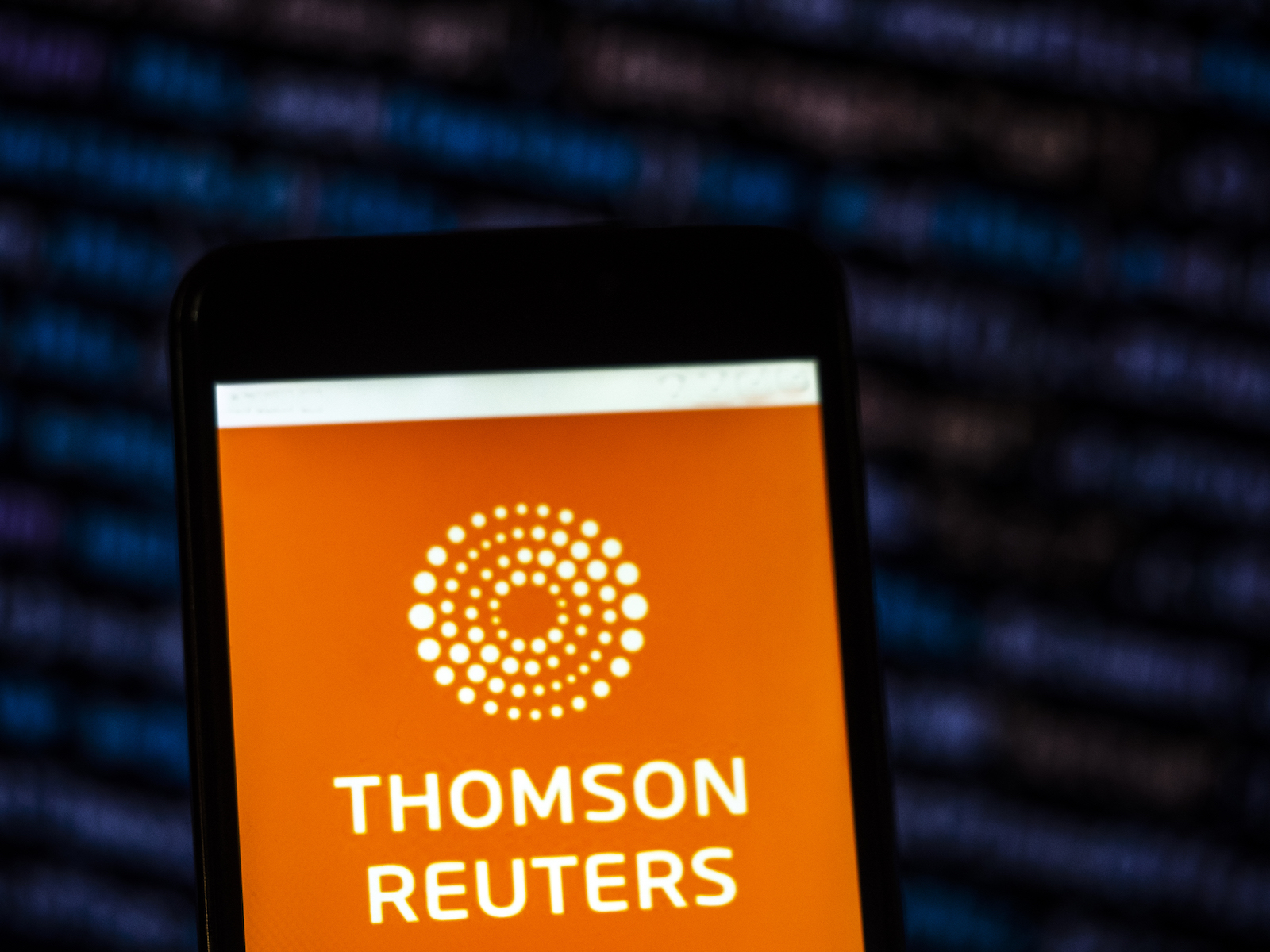 UKRAINE - 2018/11/22: In this photo illustration, the Thomson Reuters Corporation Mass media company logo seen displayed on a smartphone. (Photo Illustration by Igor Golovniov/SOPA Images/LightRocket via Getty Images)