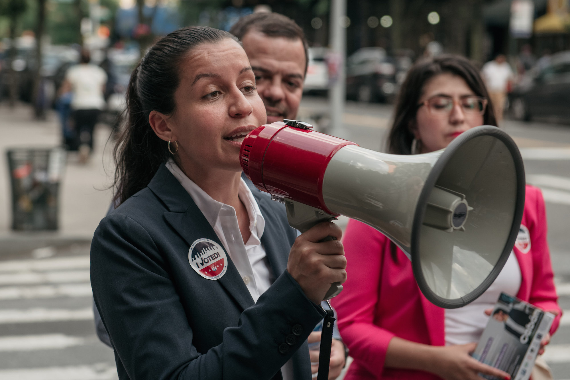 Public defender Tiffany Cabán, a candidate for Queens District Attorney, speaks with supporters in Jackson Heights, Queens hours before polls closed for the borough's Democratic primary election, June 25, 2019 in the Queens borough of New York City. Photo: Scott Heins/Getty Images.