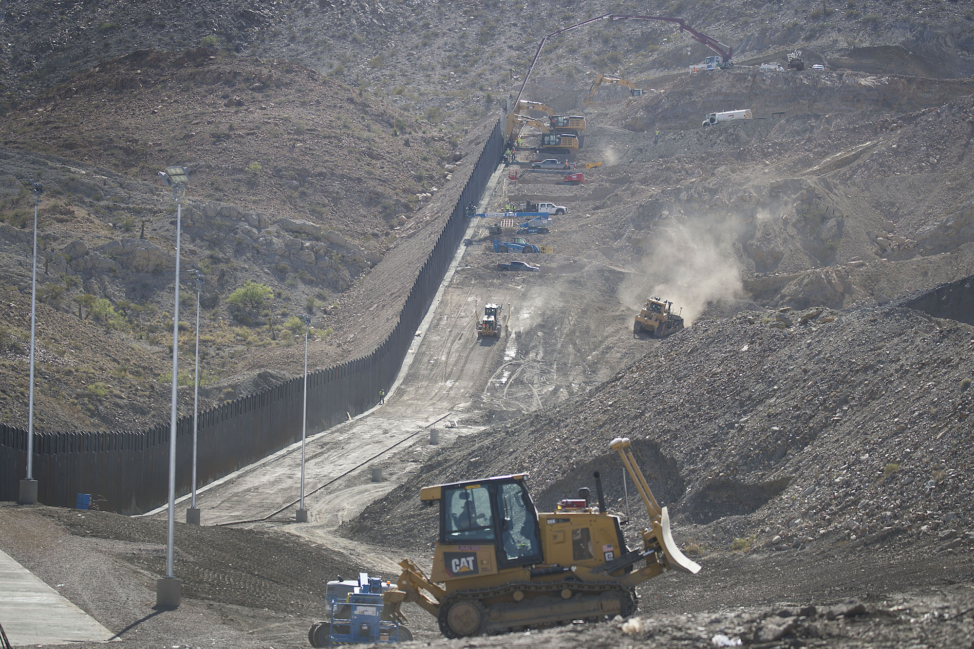 Construction crews work on a border wall being put in place by We Build The Wall Inc. on June 01, 2019 in Sunland Park, New Mexico. Photo: Joe Raedle/Getty Images.
