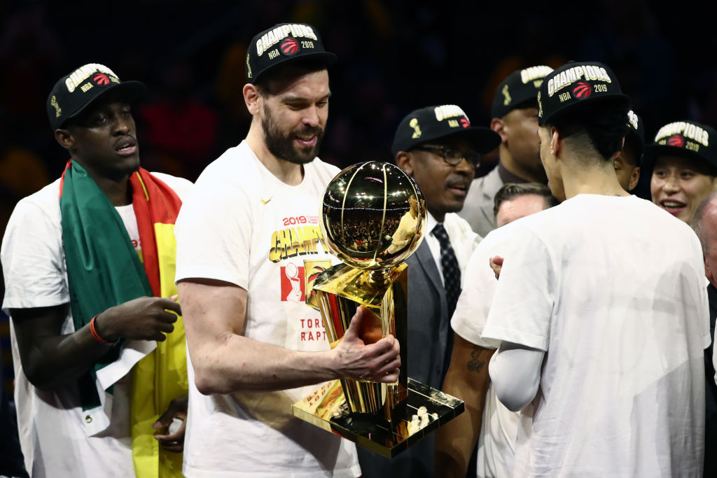 Marc Gasol #33 of the Toronto Raptors celebrates with the Larry O'Brien Championship Trophy after his team defeated the Golden State Warriors to win Game Six of the 2019 NBA Finals at ORACLE Arena on June 13, 2019 in Oakland, California. (Photo by Ezra Shaw/Getty Images)