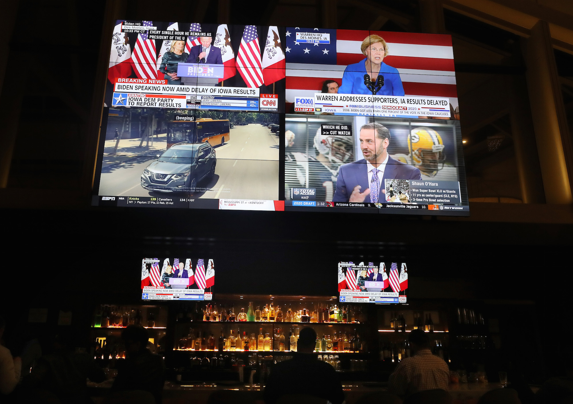 News from the Iowa caucus is broadcast on televisions in a hotel lobby bar on Capitol Hill on February 3, 2020 in Washington, DC. Photo: Mario Tama/Getty Images.