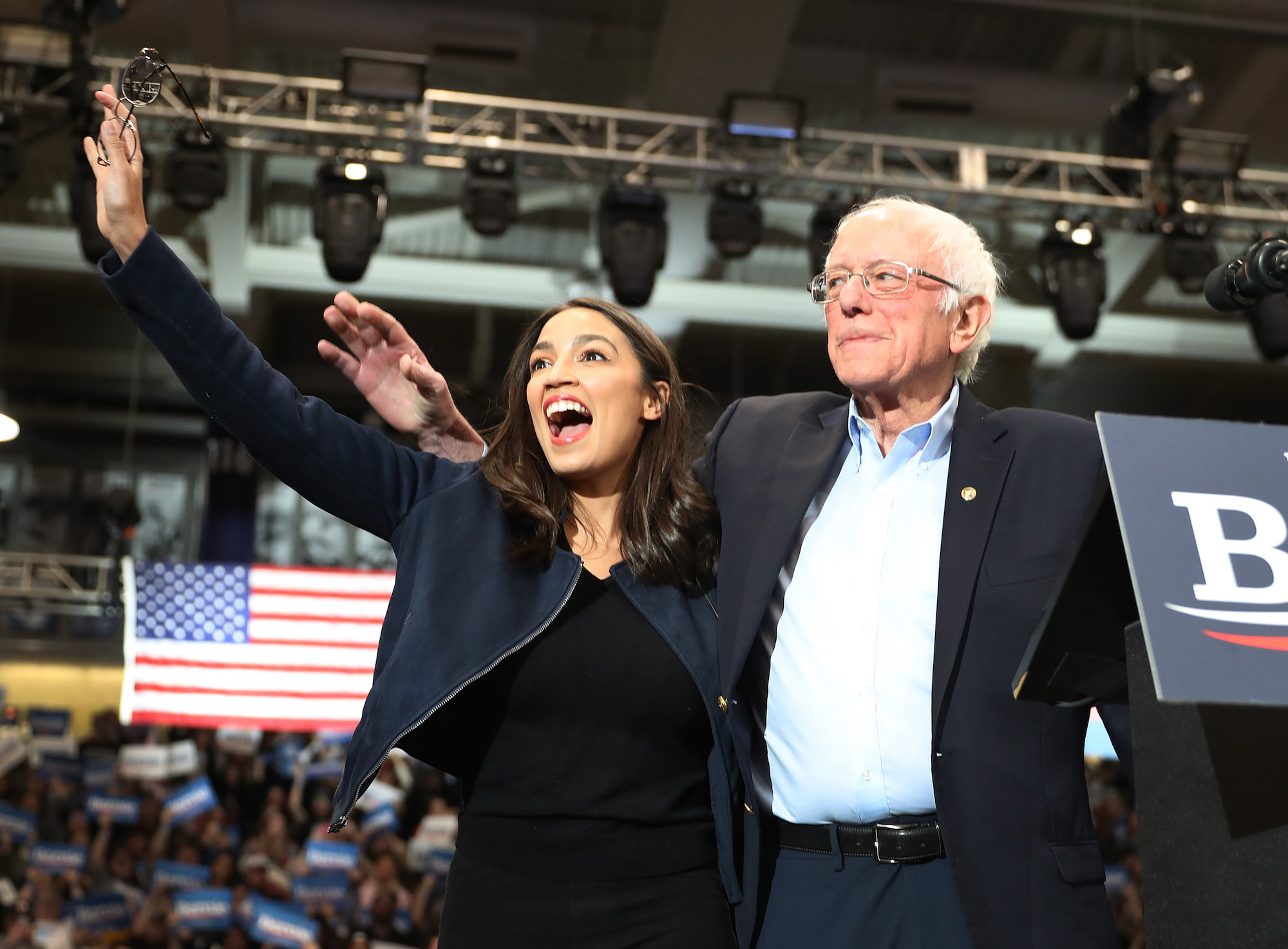 U.S. Rep. Alexandria Ocasio-Cortez (D-N.Y) and Democratic presidential candidate Sen. Bernie Sanders (I-VT) stand together during his campaign event at the Whittemore Center Arena on February 10, 2020 in Durham, New Hampshire. Photo: Joe Raedle/Getty Images.