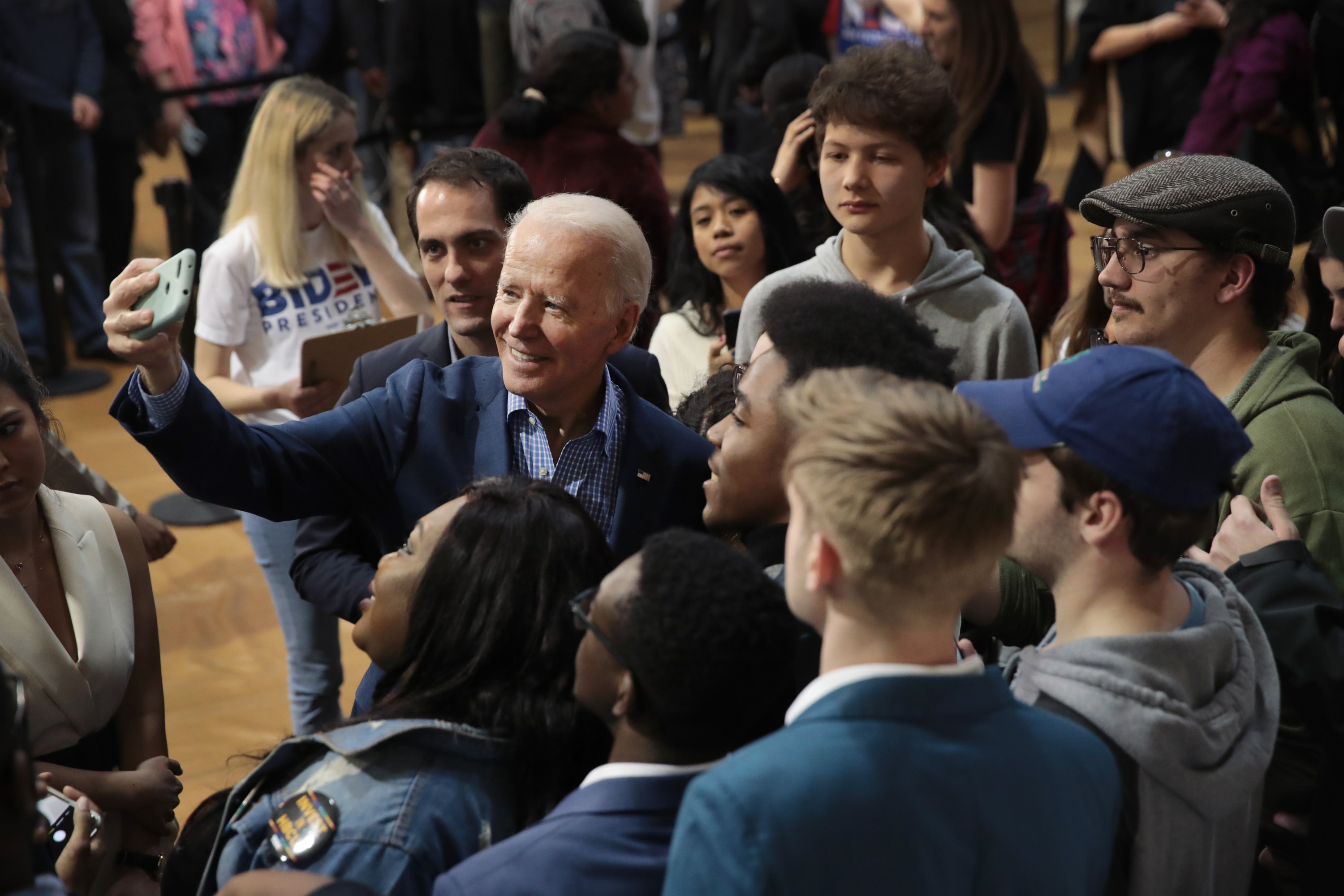 Democratic presidential candidate former Vice President Joe Biden takes selfies with guests during a campaign rally at Coastal Carolina University on February 27, 2020 in Conway, South Carolina. Photo: Scott Olson/Getty Images.