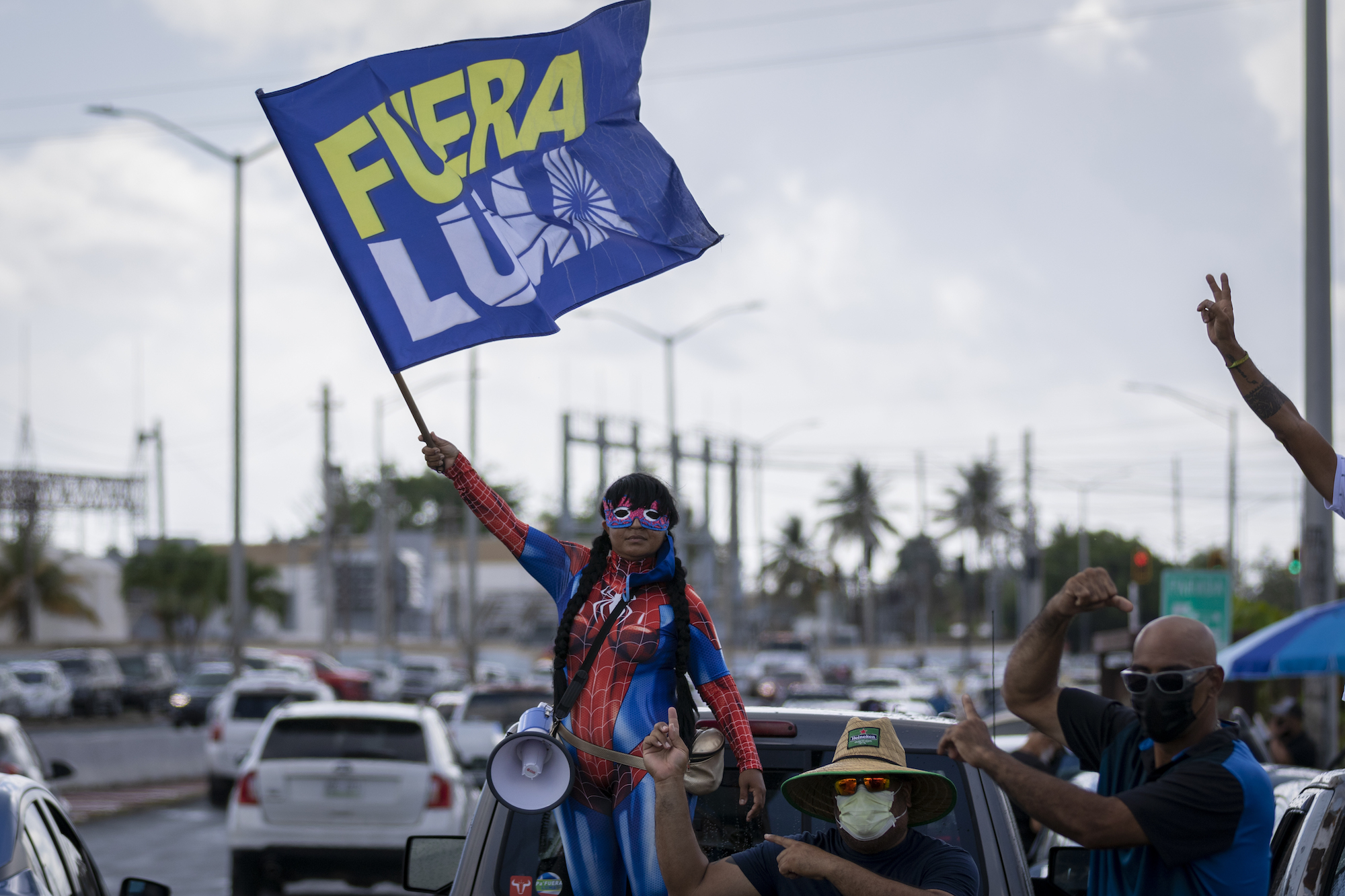 People protest against the public-private partnership between the public instrumentality and LUMA Energy in San Juan, Puerto Rico, on June 1, 2021. The private company will take over PREPA's energy transmission and distribution for the next 15 years. Photo: Alejandro Granadillo/NurPhoto via Getty Images
