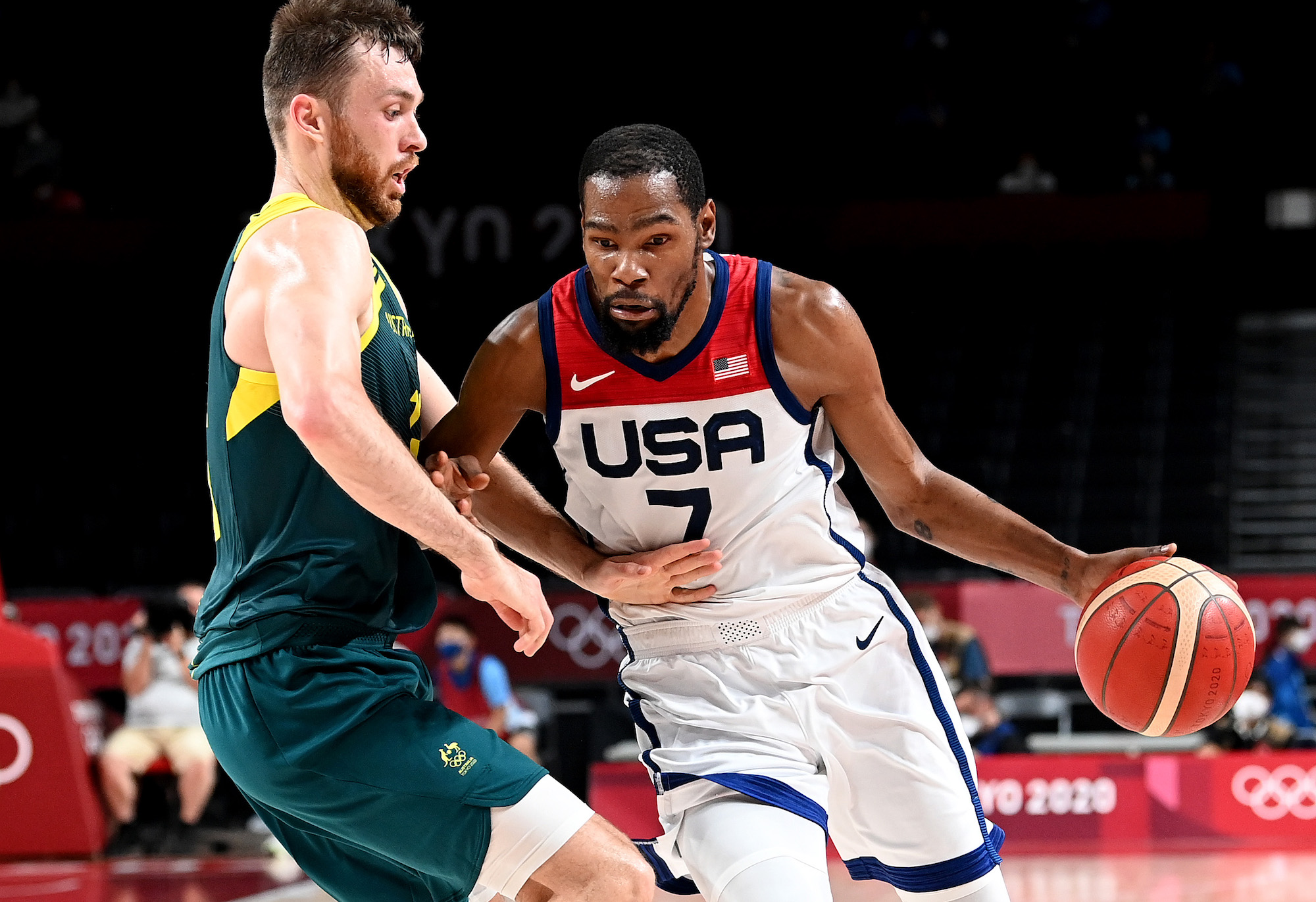 Kevin Durant of the USA takes on the defence of Nic Kay of Australia during the Basketball semi final match between Australia and the USA on day thirteen of the Tokyo 2020 Olympic Games at Saitama Super Arena on August 05, 2021 in Saitama, Japan. Photo: Bradley Kanaris/Getty Images.