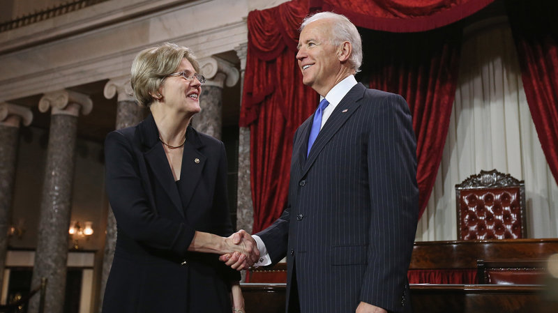 U.S. Sen. Elizabeth Warren participates in a re-enacted swearing-in with U.S. Vice President Joe Biden at the U.S. Capitol on Jan. 3, 2013. Photo: Chip Somodevilla/Getty Images.