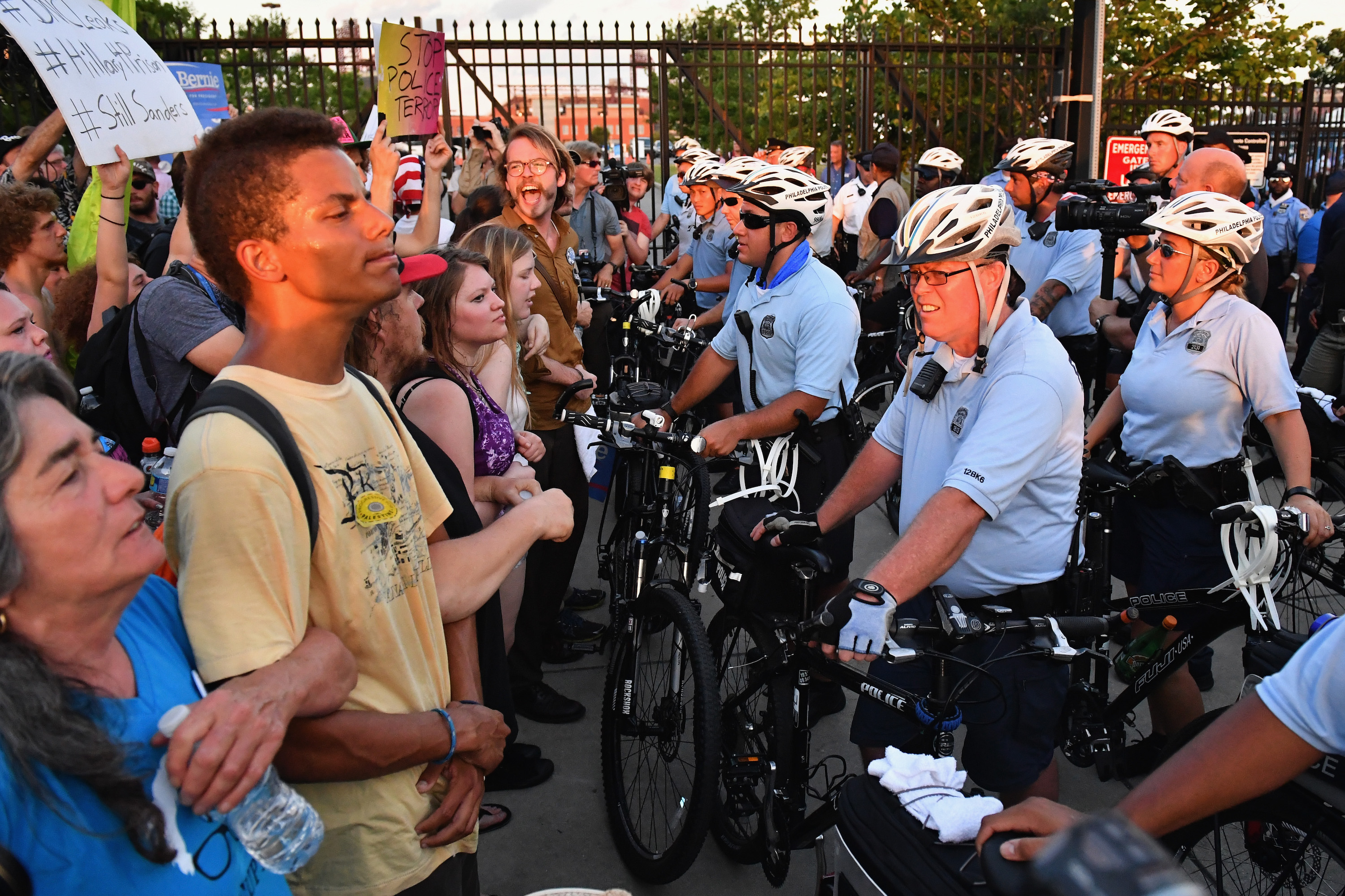 Police watch protesters near the Wells Fargo Center on the second day of the Democratic National Convention (DNC) on July 26, 2016 in Philadelphia, Pennsylvania. Photo: Jeff J Mitchell/Getty Images