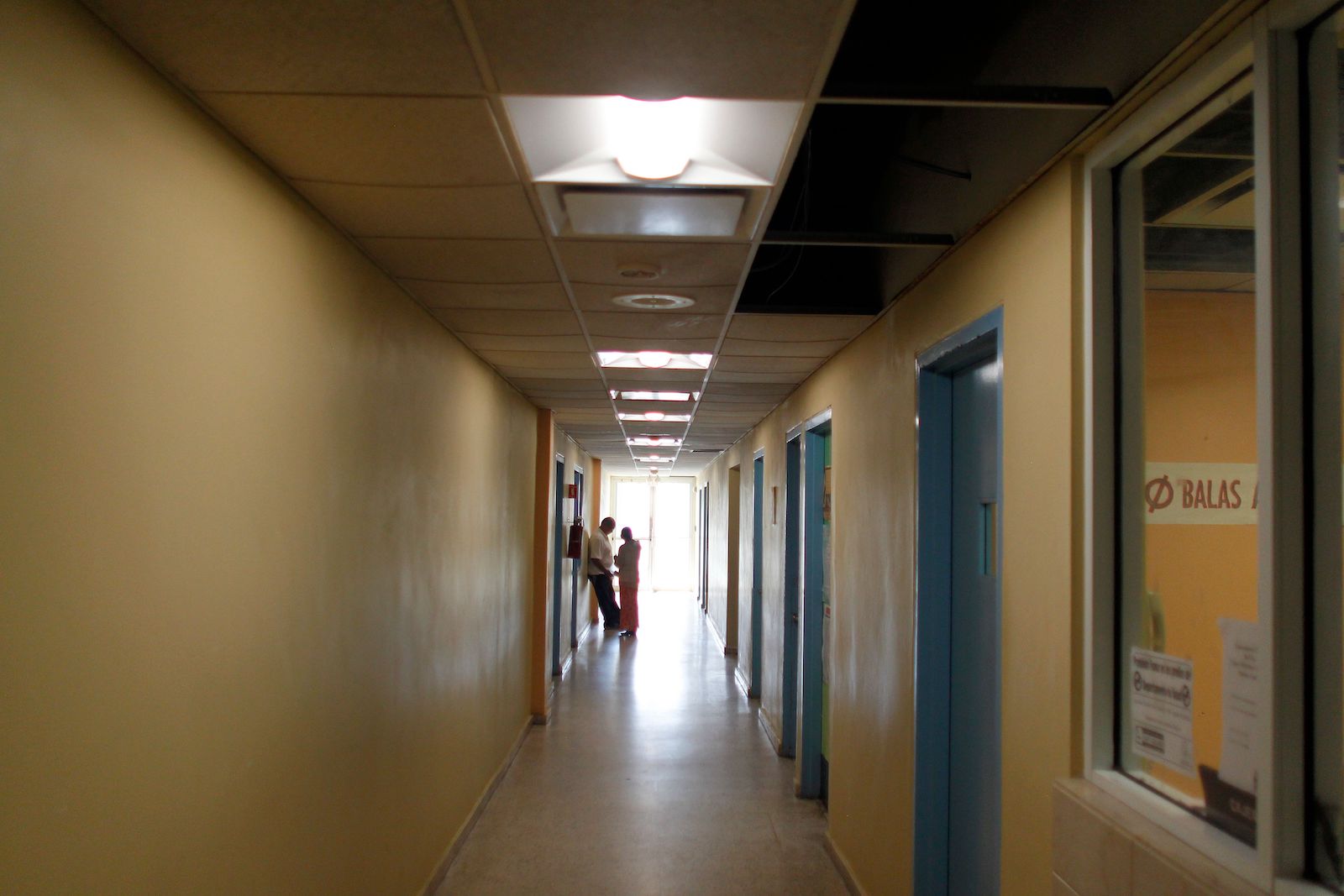 People is seen inside a hospital in Vieques, Puerto Rico on November 27, 2017. The only hospital available for the 9000 Vieques residents was damaged by Hurricane Maria and had to be closed and is only attending patients in tents outside the damaged building provided by the US Army. / AFP PHOTO / Ricardo ARDUENGO / TO GO WITH AFP STORY BY LEILA MACOR (Photo credit should read RICARDO ARDUENGO/AFP via Getty Images) 