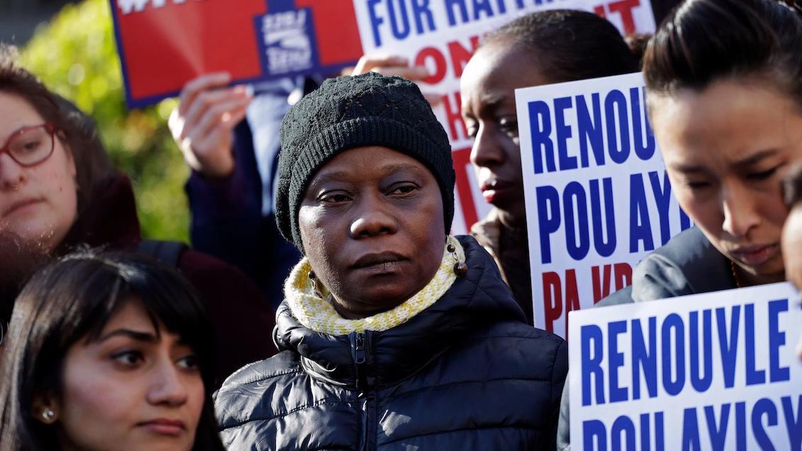 People gather in New York to protest the decision of the Trump administration to end the so-called temporary protection status for immigrants from Haiti. (Mark Lennihan / Associated Press)