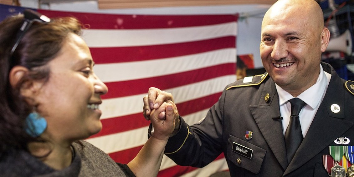 Deported U.S. Army veteran Hector Barajas-Varela celebrates with ACLU of San Diego and Imperial counties executive director Norma Chavez-Peterson after being told he would be granted American citizenship in Tijuana, Mexico, on March 29, 2018.Joel Angel Juarez / AP