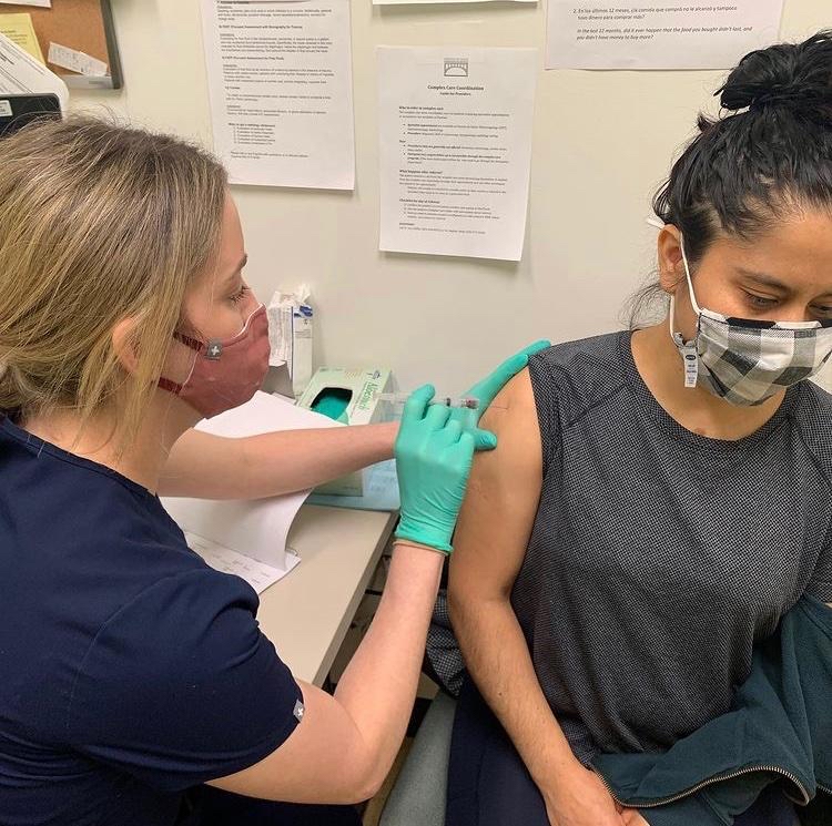 Ivonne Garcia, Philadelphia resident and community activist recieving her COVID-19 vaccine. 