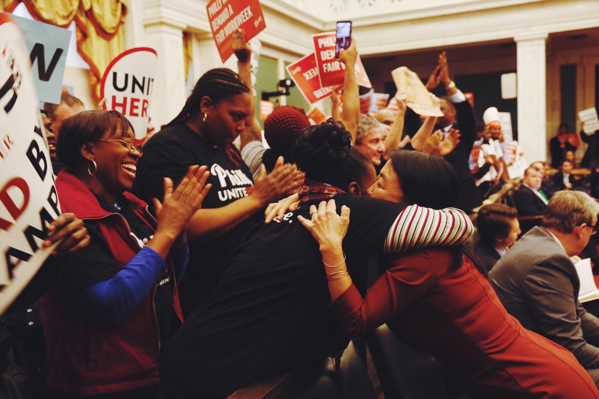 Councilwoman Helen Gym hugs a supporter of the Fair Workweek legislation. Photo: Sahar Coston-Hardy.