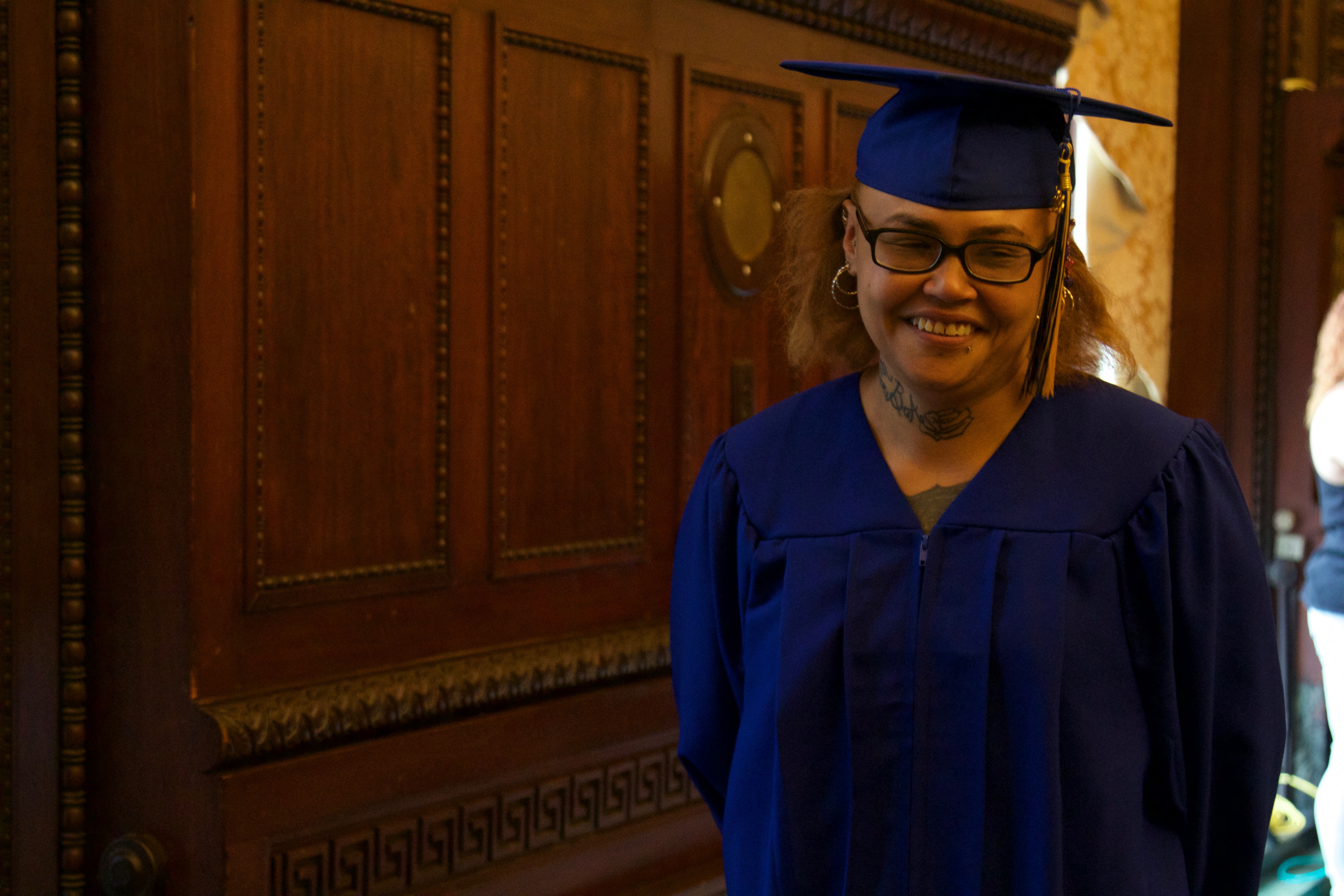 Shartelle Martinez, salutatorian, walks in the processional for the graduation ceremony at City Hall for seven first-time offenders who completed their high school diploma through The Choice is Yours program. June 1, 2018. Photo: Emily Neil / AL DÍA News