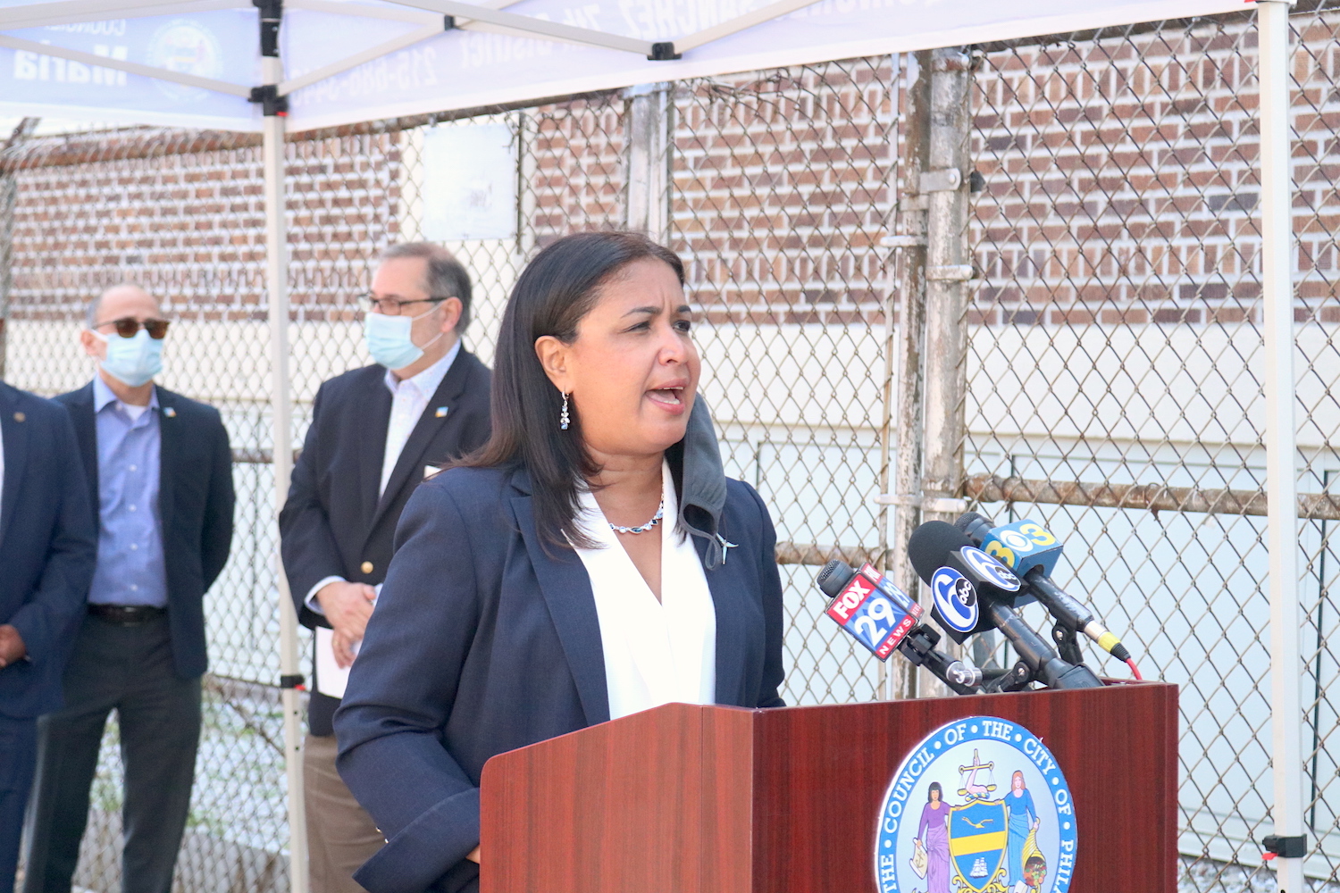 Councilmember Maria Quiñones Sanchez speaks on the opening of Esperanza’s mass vaccination site. Rev. Luis Cortés is pictured behind. Photo: Nigel Thompson/AL DÍA News