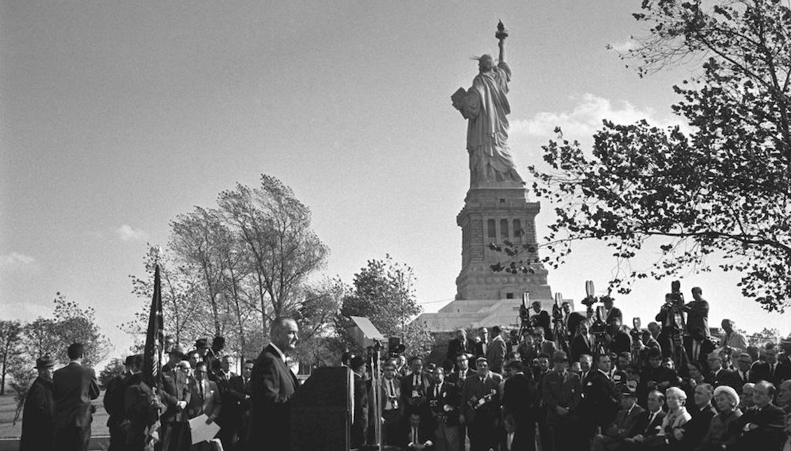 President Lyndon Johnson delivered remarks at the Statue of Liberty before signing into law the Immigration and Nationality Act of 1965. Inspired by the civil rights movement, the law did away with racial quotas in the U.S. immigration system. (LBJ Library photo by Yoichi Okamoto.)