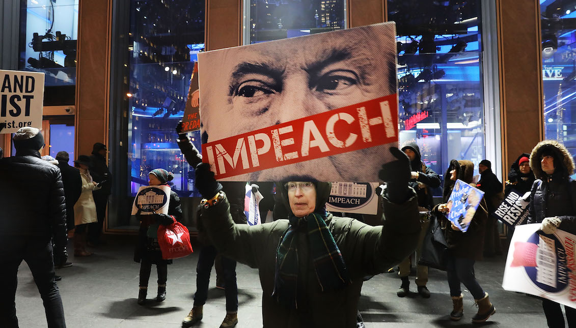 NEW YORK, NY - DECEMBER 14: People protest outside of the Fox News Channel headquarters to demand the resignation of President Donald Trump after accusations of sexual assault have re-surfaced against him on December 14, 2017 in New York City. Numerous high profile Fox executives have resigned after charges of sexual assault have forced them to resign. (Photo by Spencer Platt/Getty Images)