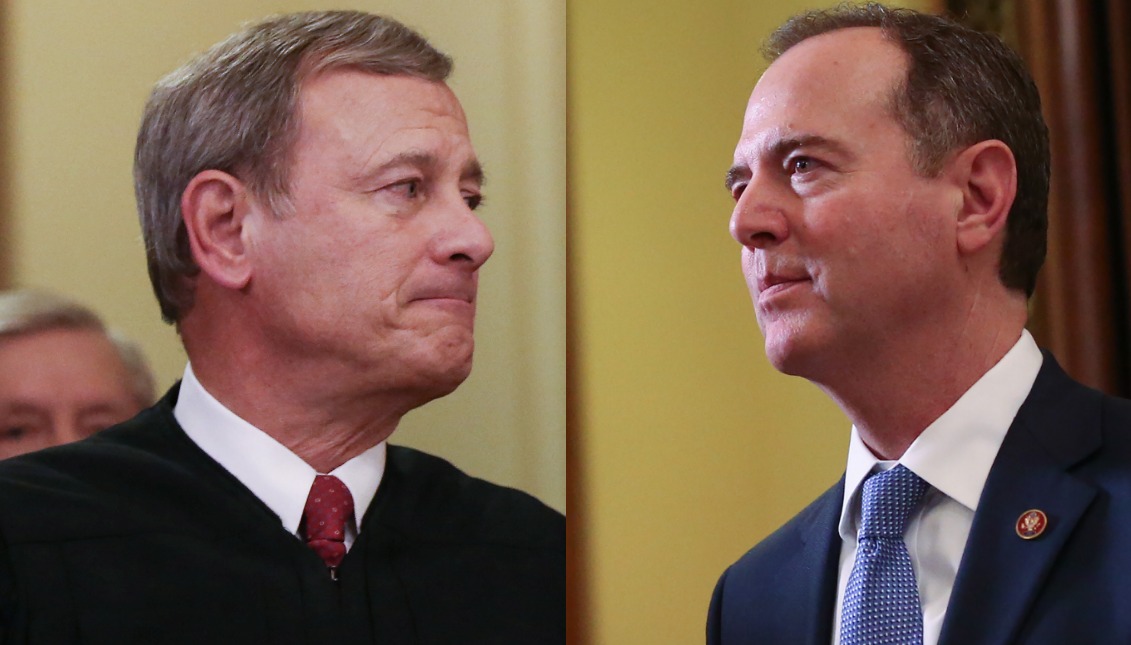 FEBRUARY 05: Chief Justice John Roberts (R) and Representative Adam Schiff (D-CA), the House impeachment manager, leave the Senate chamber. (Mario Tama/Getty Images)