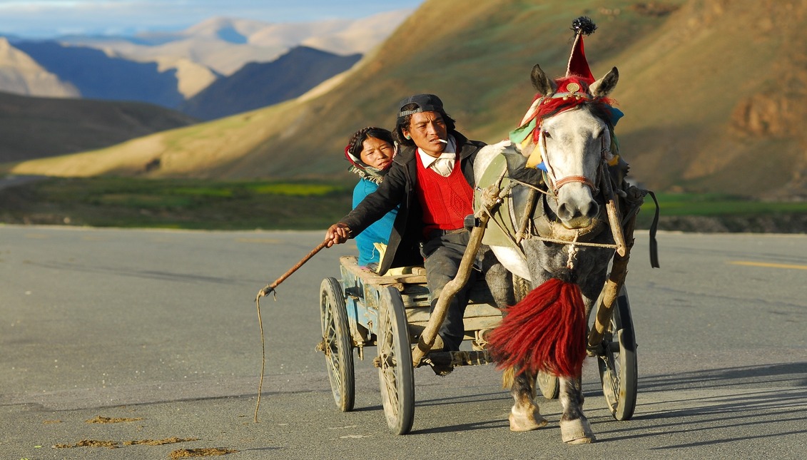 Indigenous people in a horse drawn carriage, image to illustrate Columbus Day