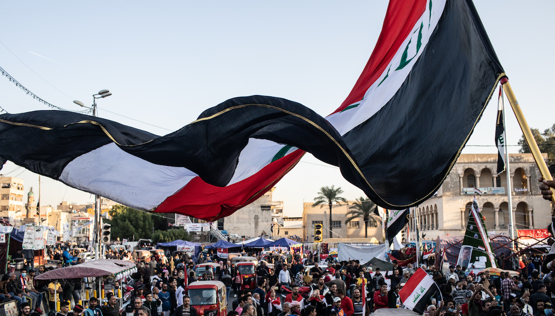 BAGHDAD, IRAQ - NOVEMBER 21: A flag waves over Tahrir Square on November 21, 2019 in Baghdad, Iraq. Thousands of demonstrators have occupied Baghdad's center Tahrir Square since October 1, calling for government and policy reform. (Photo by Erin Trieb/Getty Images)