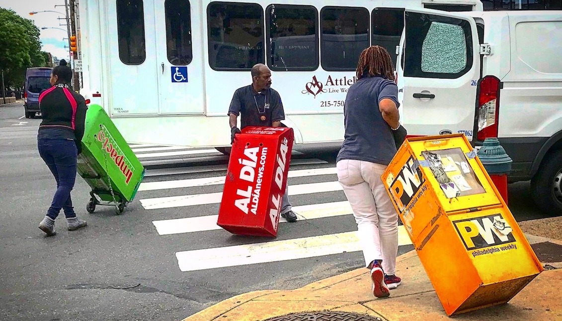 Archive photo: City workers taking away some newspaper shelves in the Spring Garden section of Philadelphia. Source: https://boxesofblight.tumblr.com/