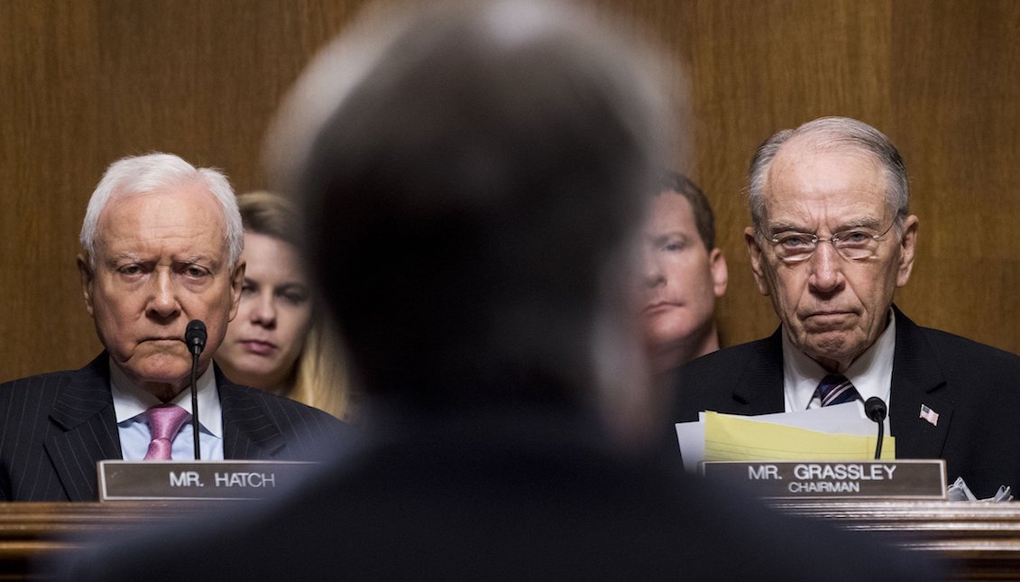 Sen. Orrin Hatch and Sen. Chuck Grassley, listen as Judge Brett Kavanaugh testifies during the Senate Judiciary Committee hearing. Tom Williams—CQ-Roll Call/Getty Images.