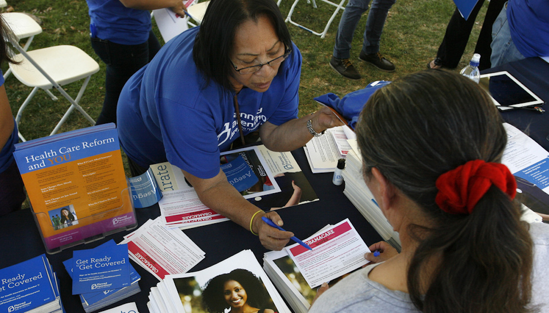 Planned Parenthood worker Alicia Gonzales promotes the Affordable Care Act during an outreach event for the Latino community in Los Angeles in September. Reuters/Landov