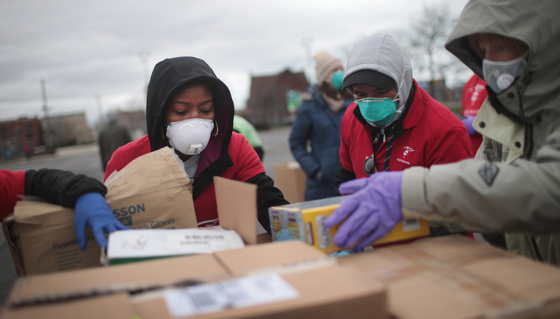 Staff and volunteers hold a drive for personal protective equipment to donate to hospitals in Chicago, where 70% of people who have died from COVID-19 are African American. Scott Olson/Getty Images