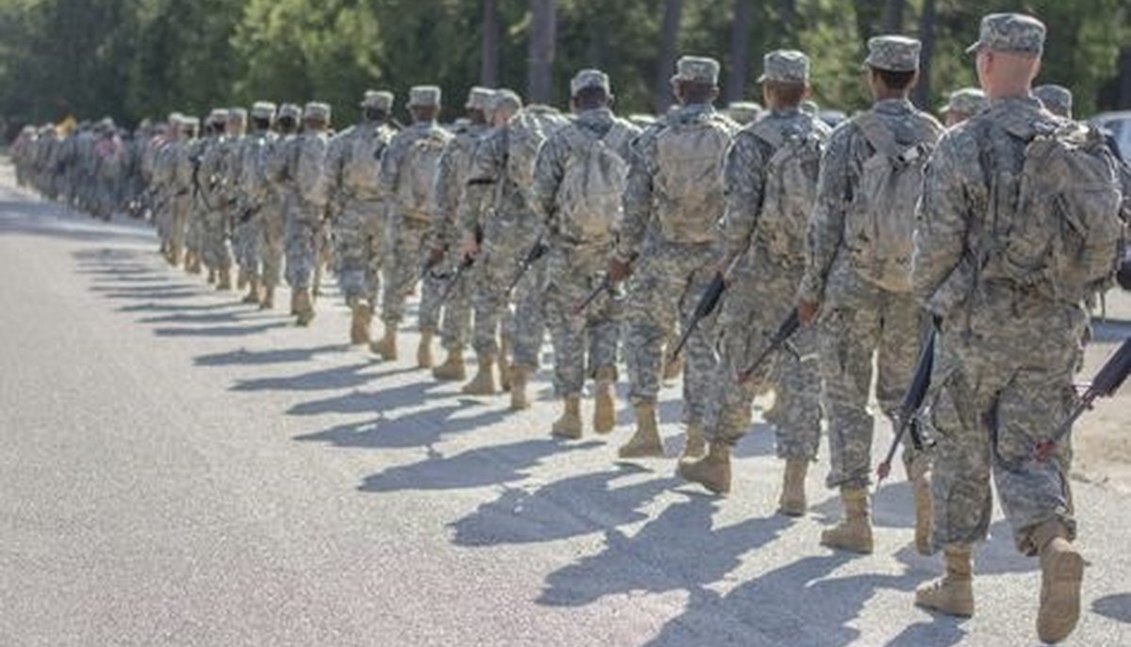 Army recruits march in this file photo. A lawsuit by several Army reservists says they have fulfilled requirements of a program for immigrant recruits but may be forced out and deported. (Sgt. Ken Scar/Army).