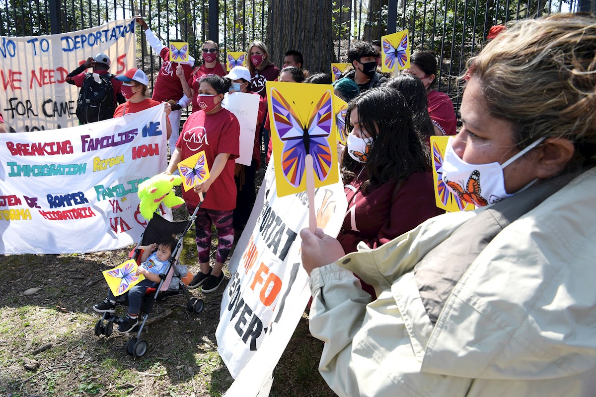 A group of immigrants protest in front of Kamala Harris' home in Washington.