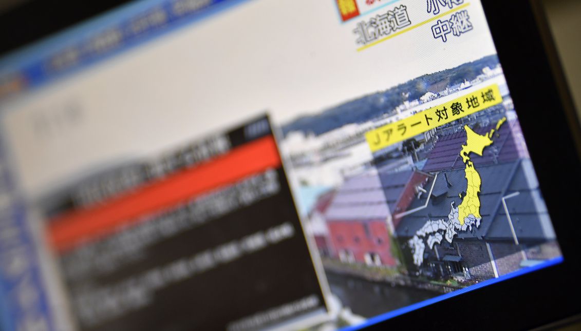 A view of a screen displaying a Japanese national TV news program broadcasting a J-Alert warning system after North Korea launched a ballistic missile towards Japan, in Tokyo, Japan, Sept. 15, 2017. EPA-EFE/FRANCK ROBICHON