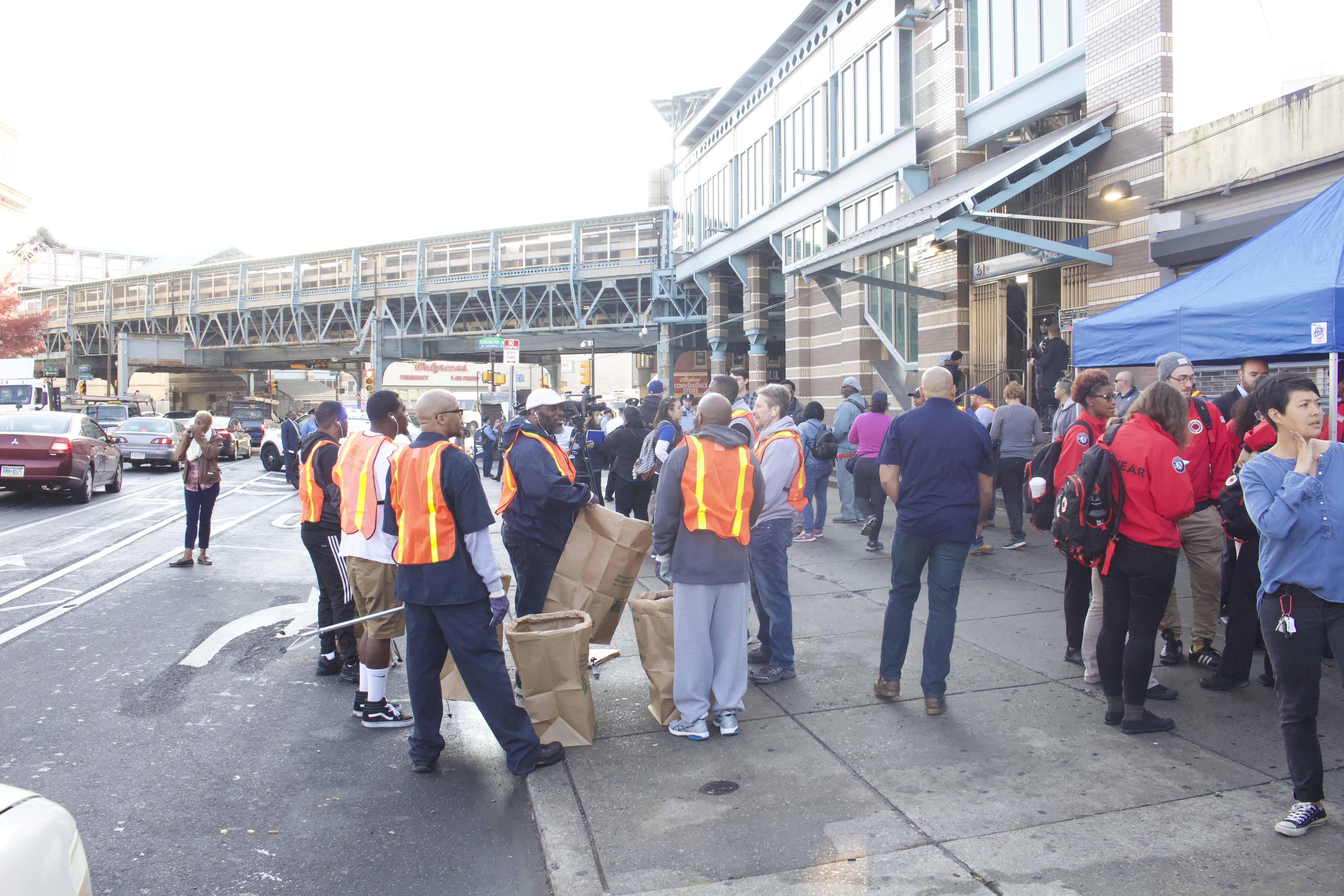 Volunteers and city officials clean up Kensington Avenue on November 1.
