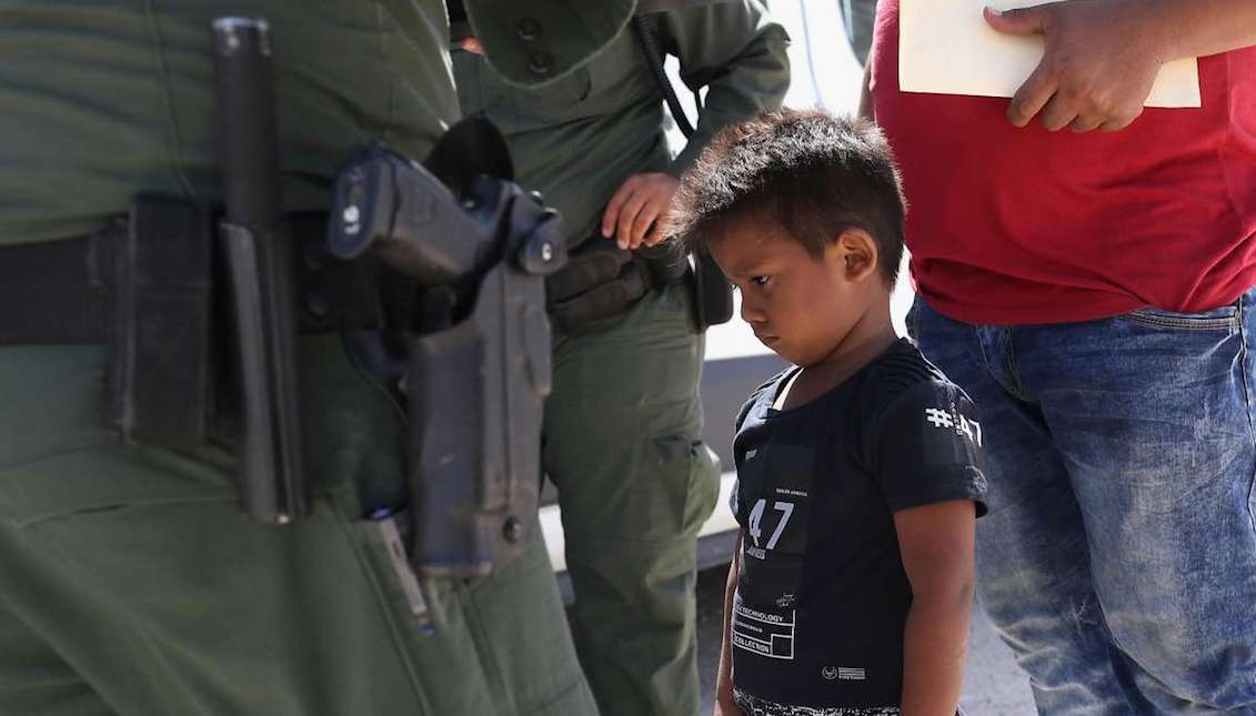 MISSION, TX - June 12: A Honduran boy and father are apprehended by United States Border Patrol agents near the US-Mexico border on June 12, 2018 near Mission, Texas. Photo: John Moore / Getty Images