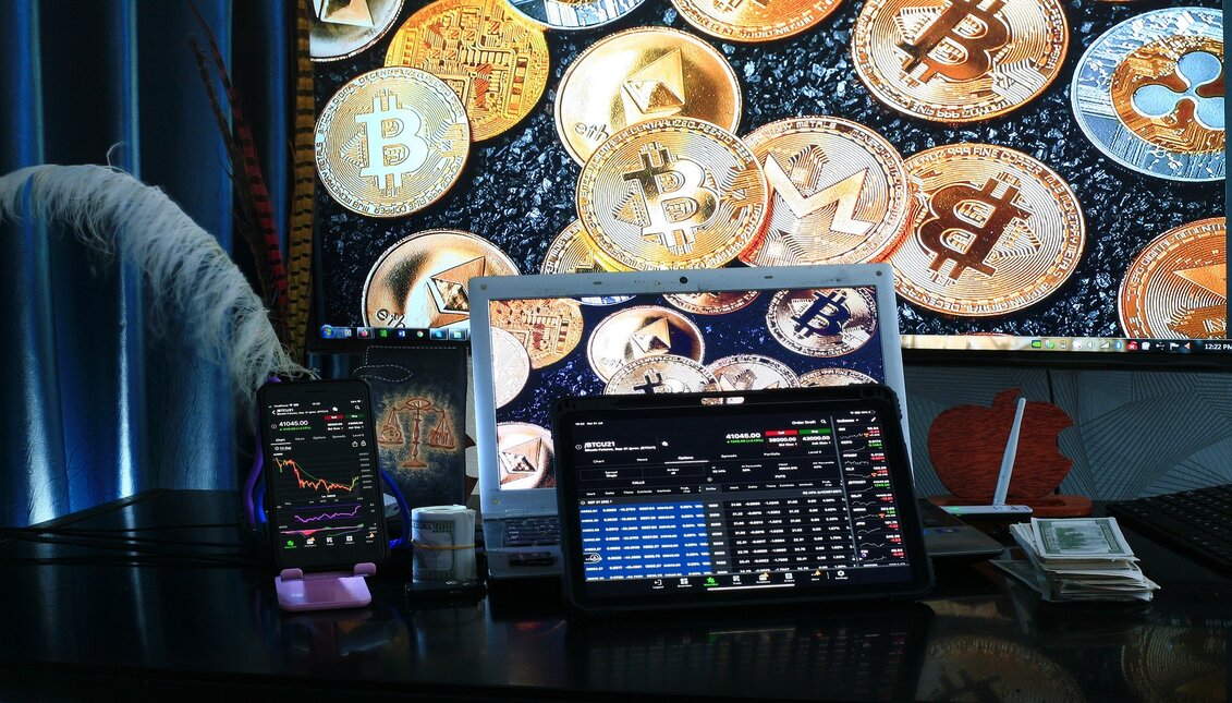 Screens with figures and bitcoin coins