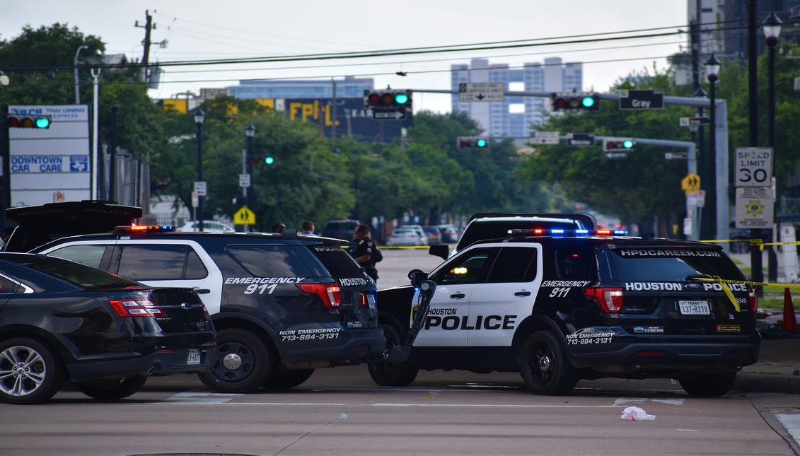 Police patrols guard a crime scene