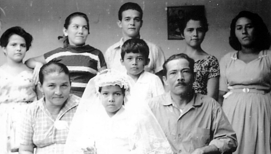 Rogelia Calderón de Guaracao (front row, seated at left) as a young mother with only 4 of my sisters and 1 of my brothers. To the right, the patriarch, seated, Don Pedro Guaracao, a direct descendant of native Americans.