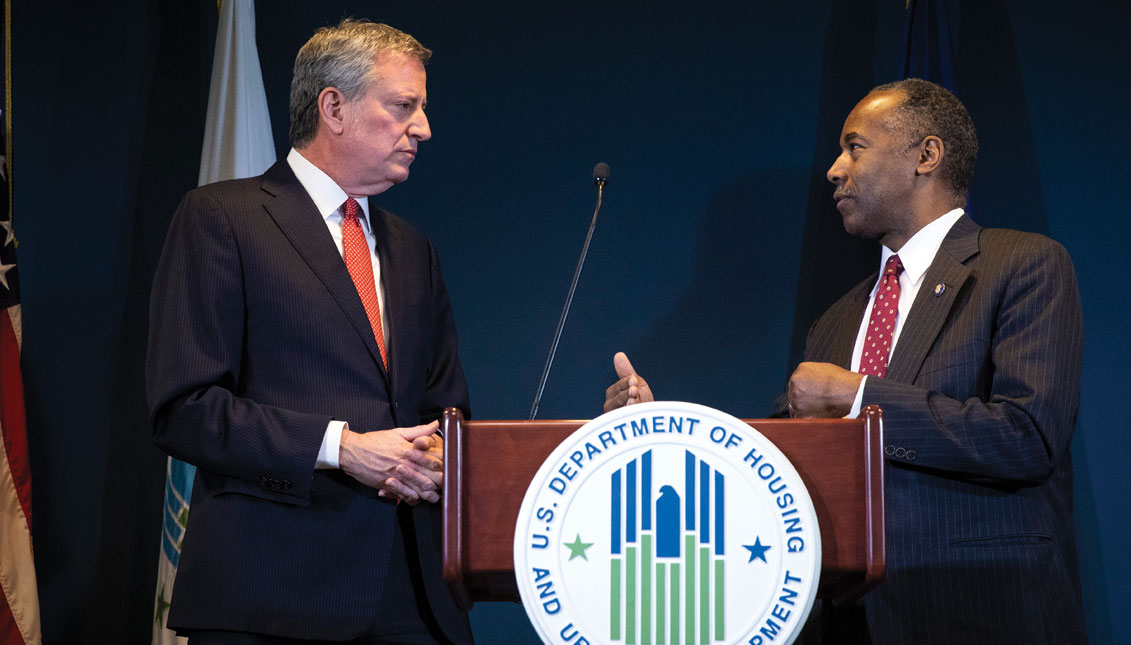 New York City Mayor Bill de Blasio and Ben Carson, Secretary of Housing and Urban Development (HUD), take questions after signing a ceremonial agreement between the federal government and the City of New York intended to correct mismanagement of the New York City Housing Authority (NYCHA), during a press conference at the Jacob Javits Federal Building, January 31, 2019 in New York City. (Photo by Drew Angerer/Getty Images)