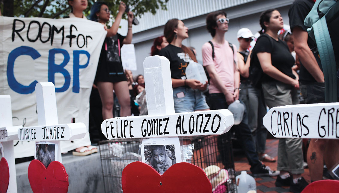 Crosses memorializing immigrants who died while in custody of U.S. Customs and Border Protection (CBP) sit across from the Marriott Marquis hotel in Chicago, Illinois.  (Photo by Scott Olson/Getty Images)