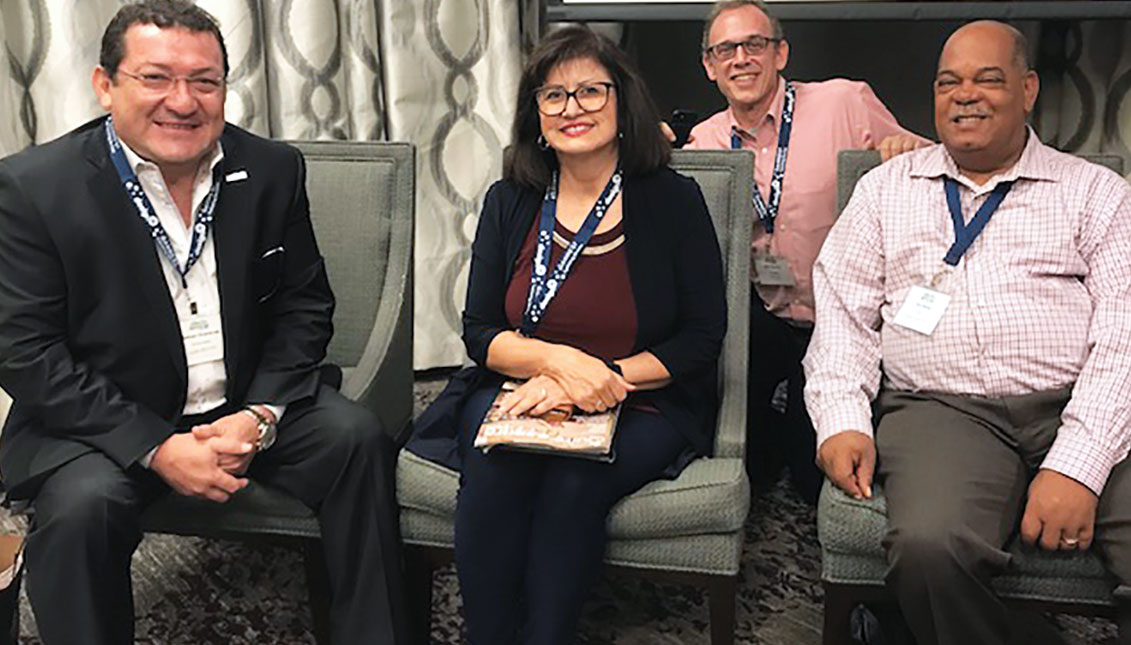 From left to right, the CEO of AL DÍA Hernán Guaracao, the CEO of EC Hispanic Media, Martha de la Torre, and the NNPA VP of Sales Ron Burke last weekend in Boulder, Colorado. Behind them, John Heaston, President of AAN and Publisher of The Reader in Omaha, Nebraska. Photo: Courtesy of Hernán Guaracao