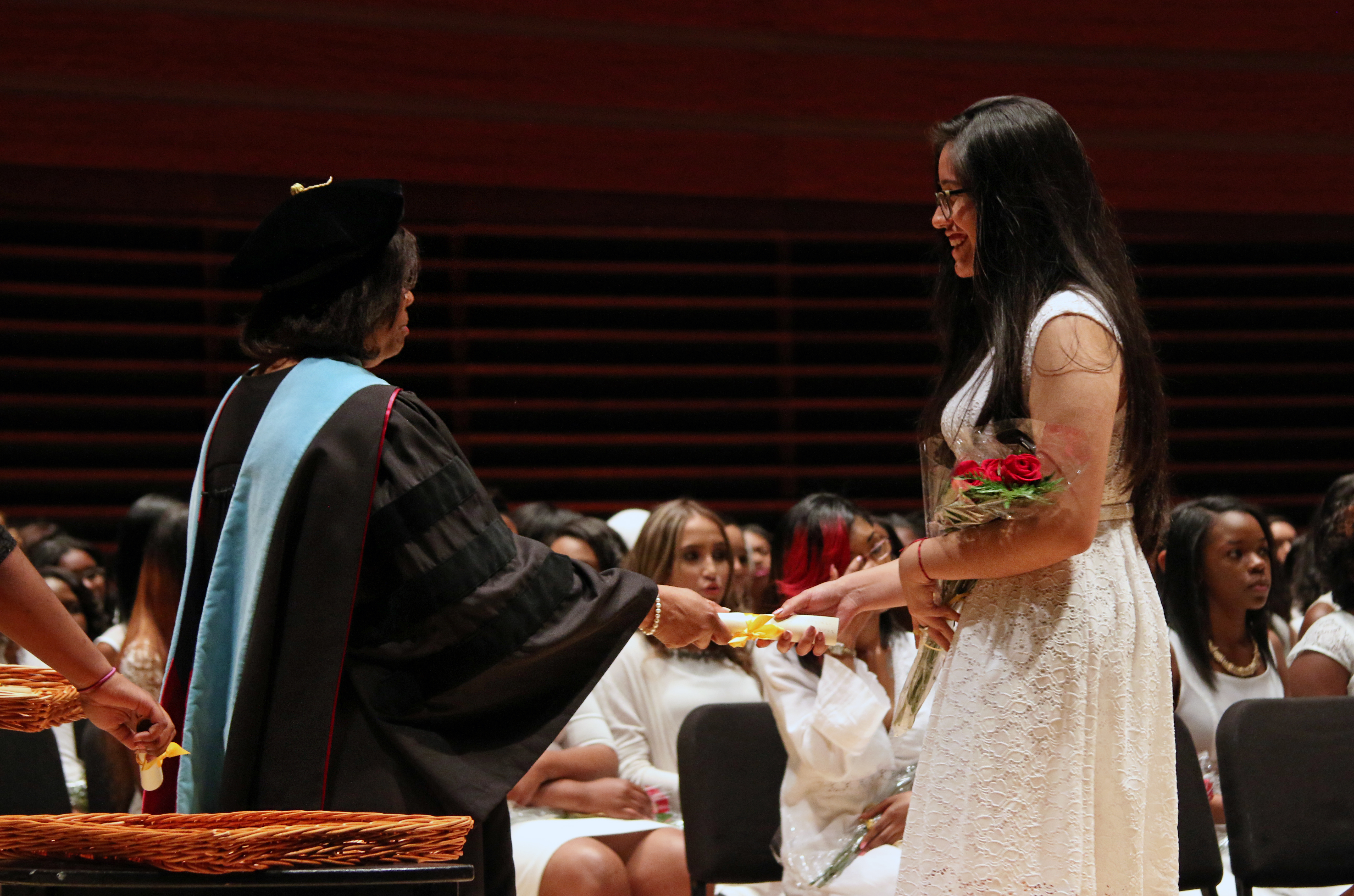 Aylin Vazquez De La Cruz receiving her high school diploma at graduation. (Photo: Samantha Madera/AL DÍA News)
