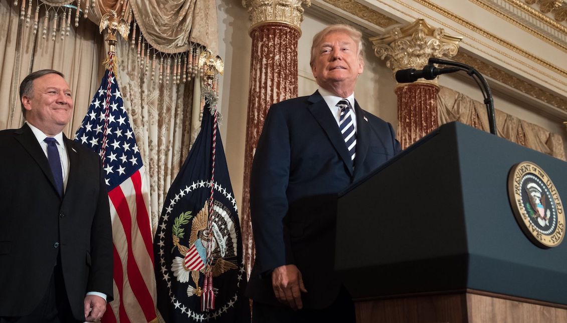 U.S. President Donald Trump attends the ceremonial swearing-in of Secretary of State Mike Pompeo at the State Department in Washington, D.C. on May 2, 2018. (Saul Loeb/AFP/Getty Images).