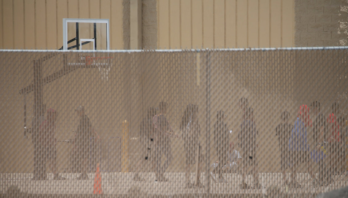 Migrant children in a recreation area outside Casa Padre. Credit Loren Elliott/Reuters