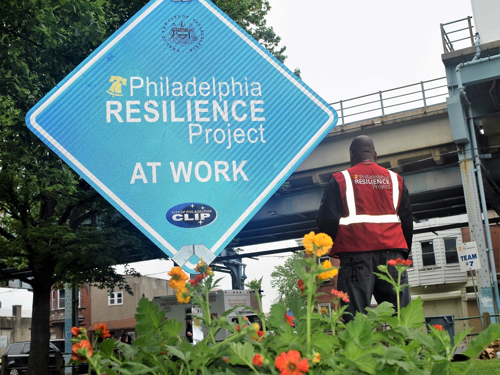 A sign announcing the work of the Philadelphia Resilience Project in Harrowgate. They can be seen across Kensington and Fairhill. Photo: Philadelphia Mayor's Office