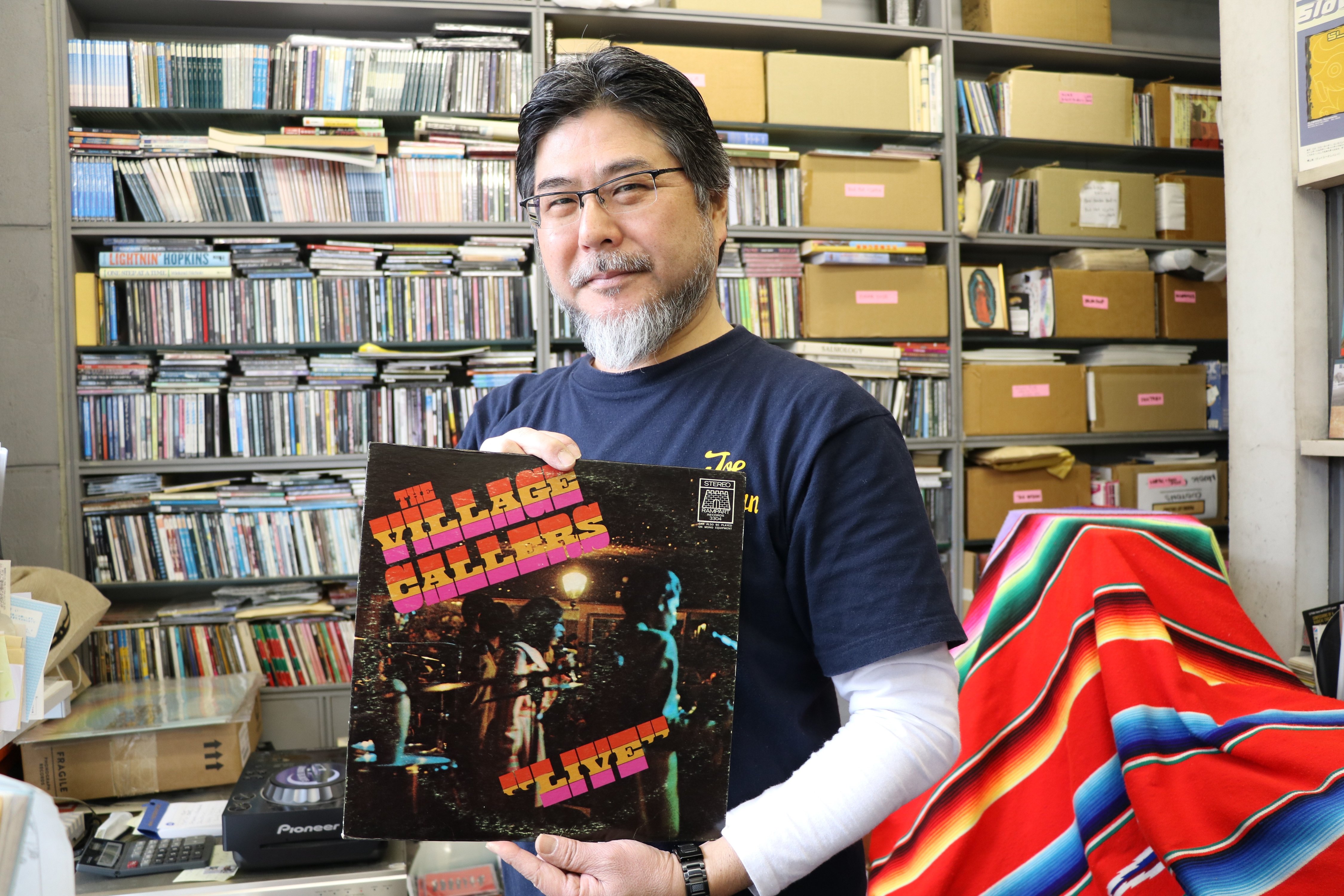 Shin Miyata poses in his office west of Tokyo, Japan, with a vinyl record of The Village Callers, one of the most famous East Los Angeles bands of the 1960s. EFE