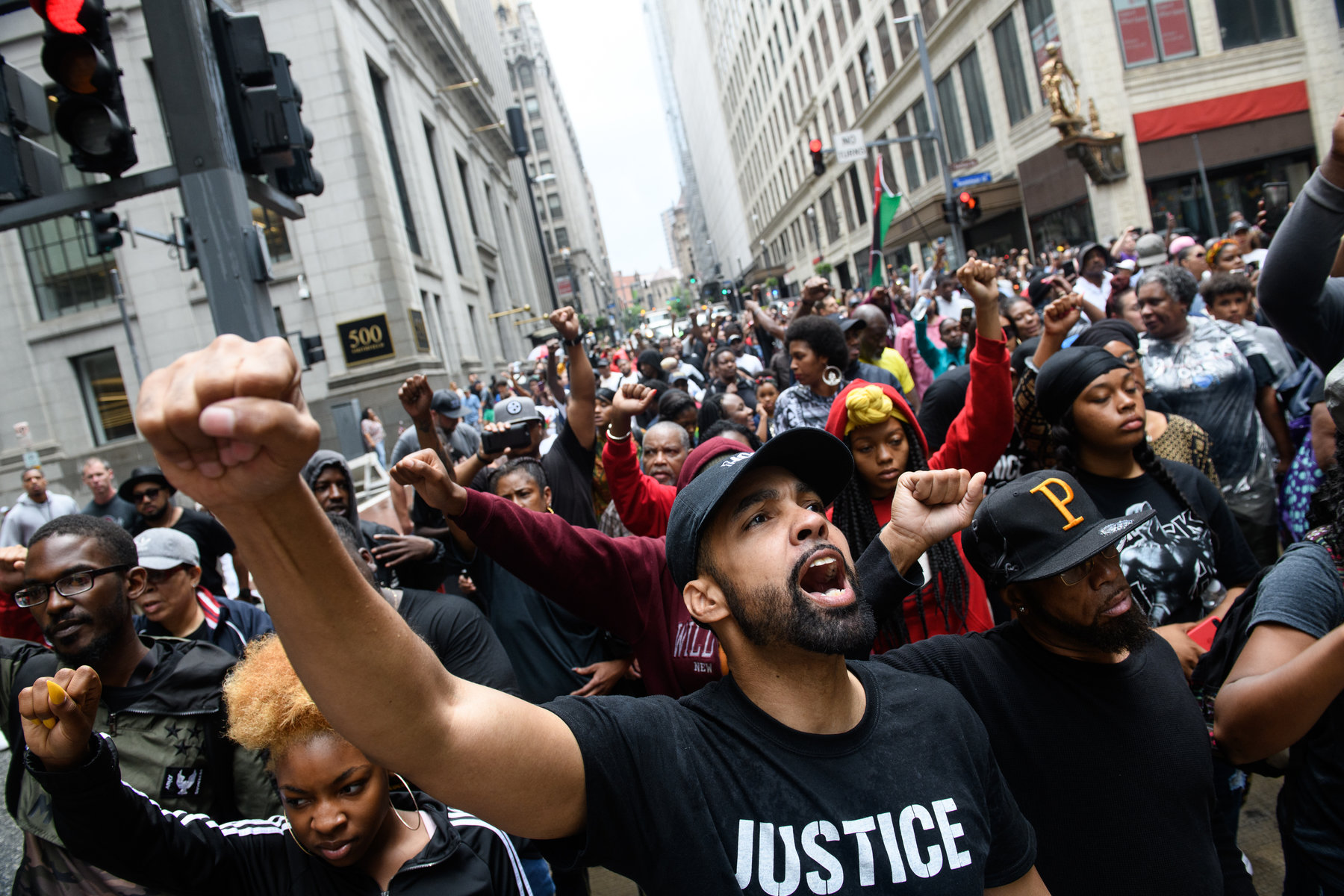 Protestors join a march for the police shooting of Antwon Rose during a Juneteenth celebration on June 23, 2018 in Pittsburgh, Pennsylvania. Rose, an unarmed black teenager, was shot Tuesday night, leading to protests and outraged across the city. Juneteenth commemorates the June 19, 1865, announcement of the abolition of slavery in the U.S. state of Texas. (Photo by Justin Merriman/Getty Images)