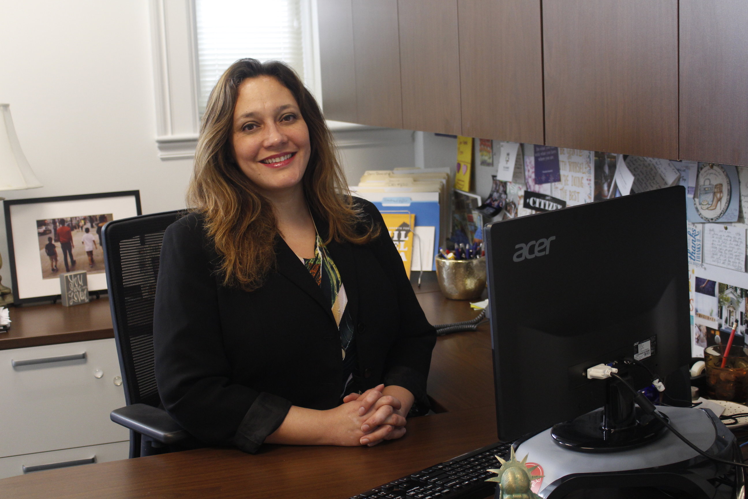 Yvette Núñez sits at her desk at the Chamber of Commerce for Greater Philadelphia. Photo: Jensen Toussaint/AL DÍA News. 