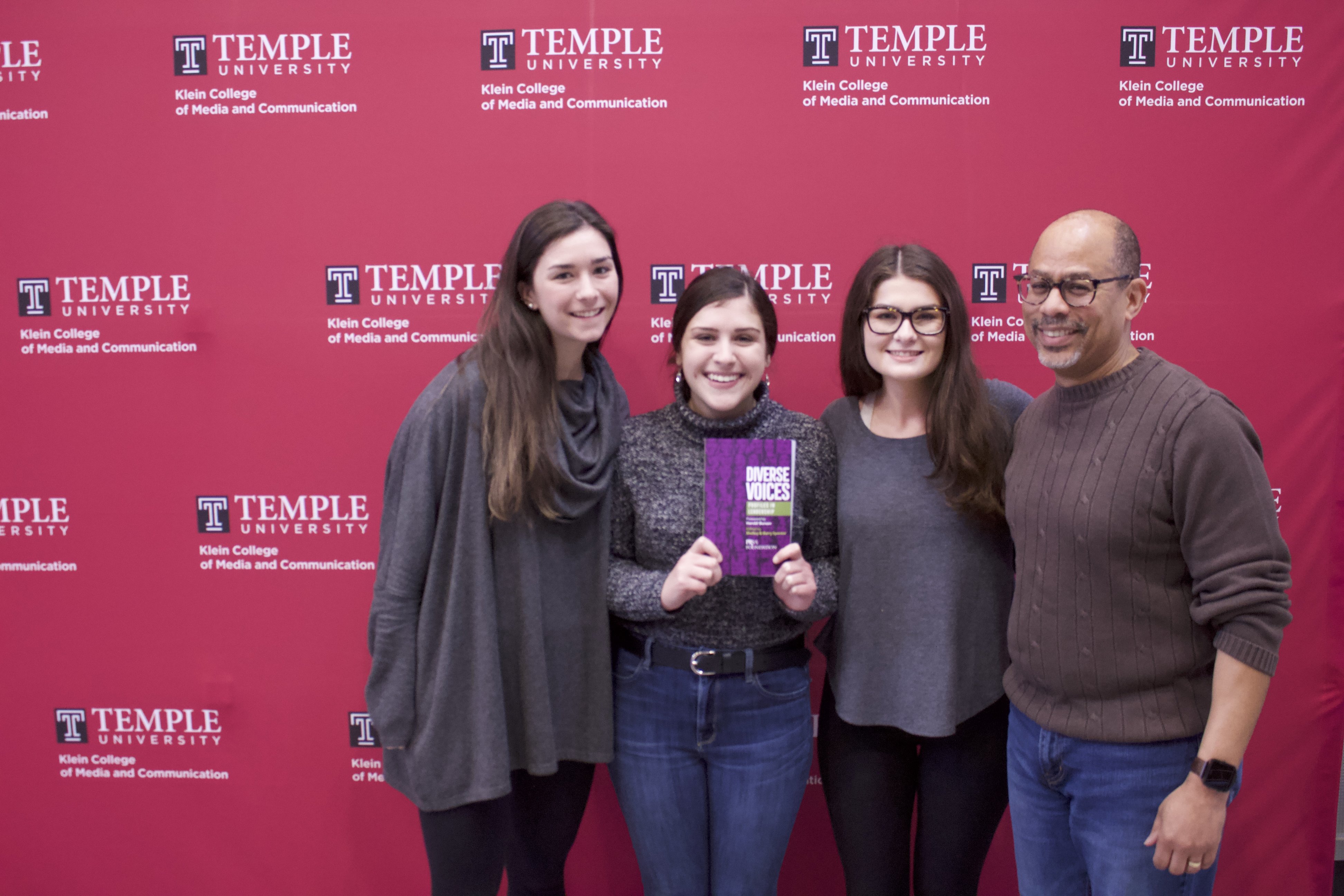 From Left to Right: (Bateman Competition team members) Mary Kate O'Malley, Christina Borst, Rose McBride, and (Public Relations Professor) David Brown with a copy of the book "Diverse Voices: Profiles in Leadership." Photo: Jensen Toussaint / AL DÍA News