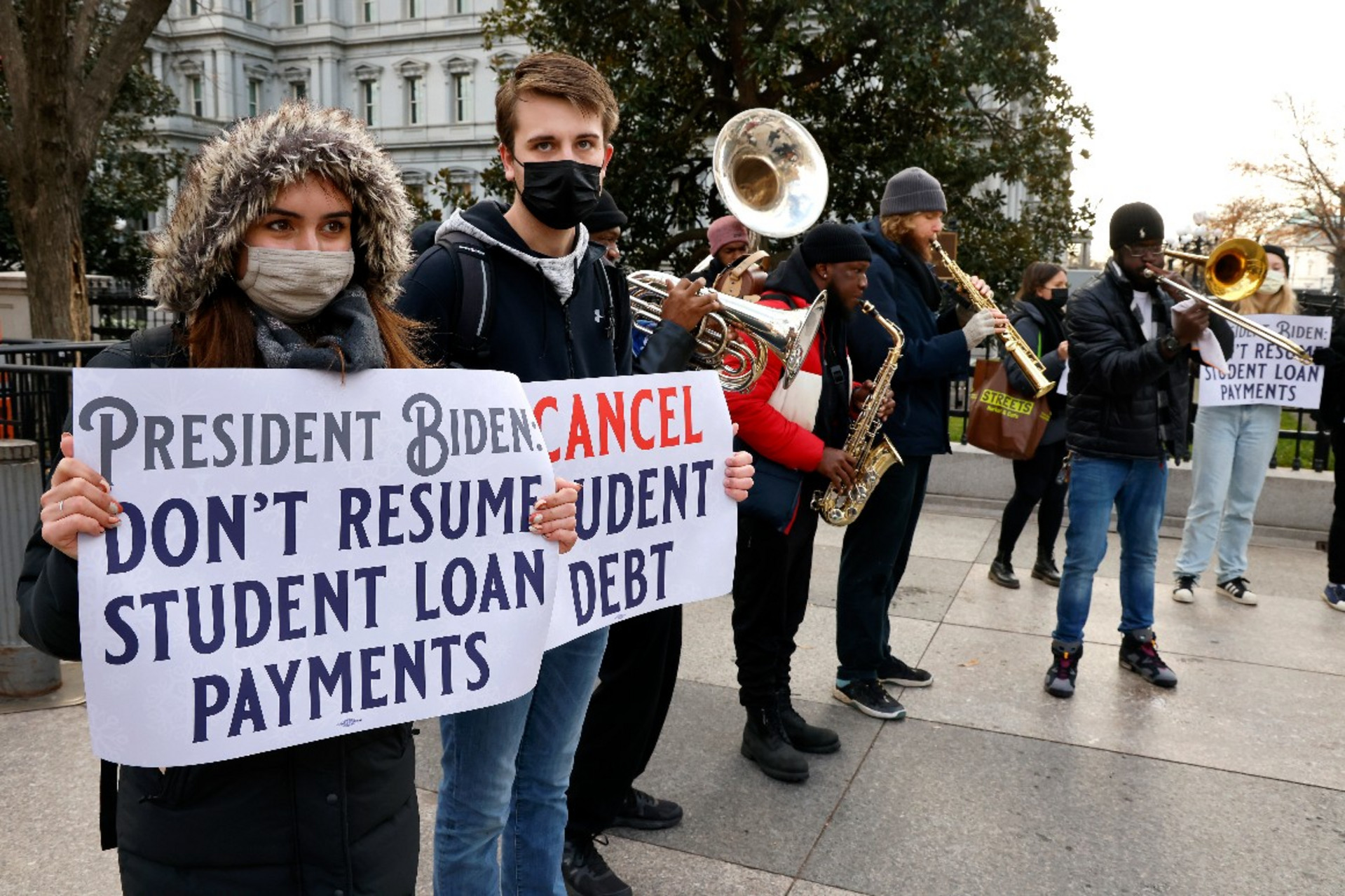 Activists protest for student loan cancellation outside of the White House. Photo credit: Paul Morigi/Getty Images