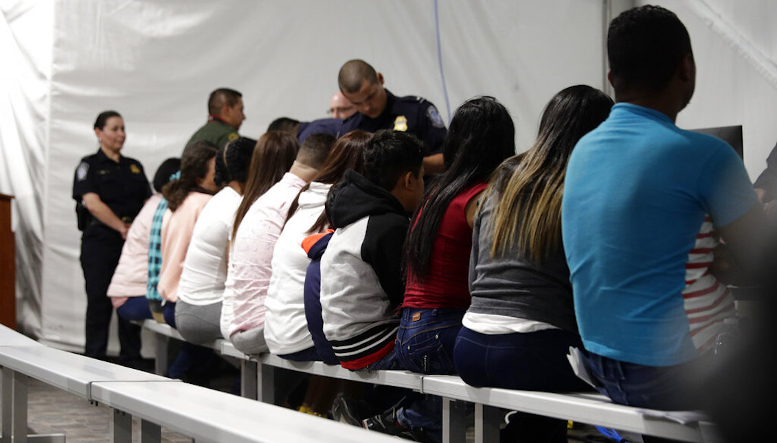 Migrants who are applying for asylum in the United States go through a processing area at a new tent courtroom at the Migration Protection Protocols Immigration Hearing Facility, Tuesday, Sept. 17, 2019, in Laredo, Texas. (AP Photo/Eric Gay)